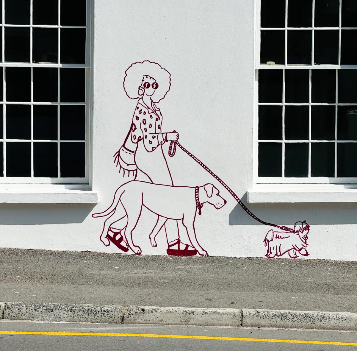 Left facade — awnings and dog walker — House of Chommies, 110 Hatfield Street, Gardens, Cape Town
