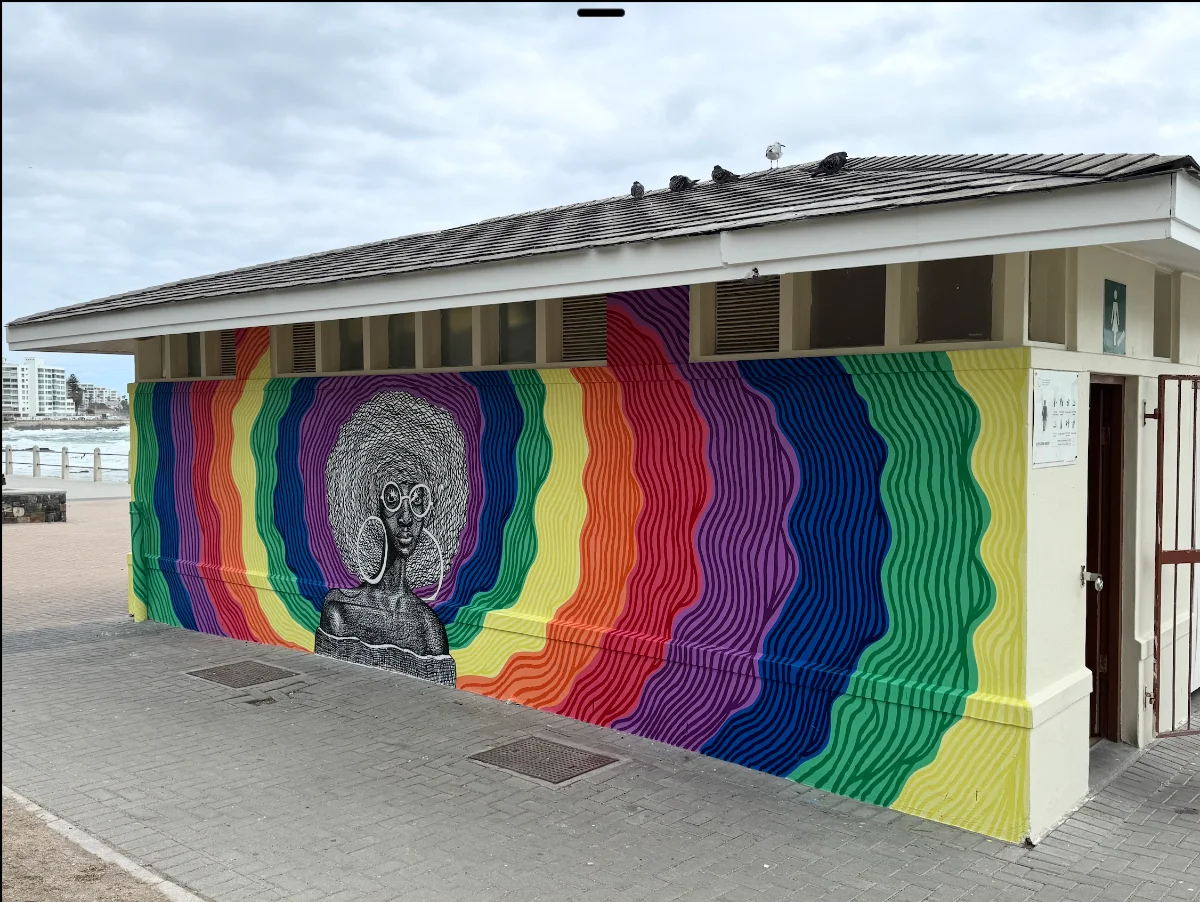Mural detail — figure and waves — Waves of Pride, 249 Beach Road, Sea Point Promenade, Cape Town