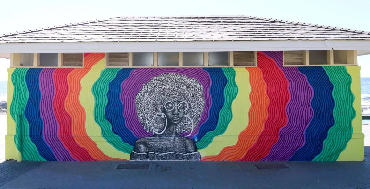 Waves of Pride — hand-painted mural by Cape Town Mural Arts, 249 Beach Road, Sea Point Promenade, Cape Town